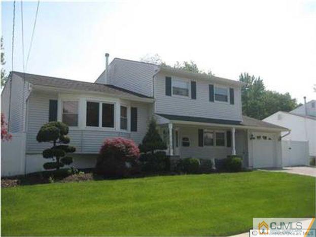 18 Chelsea Road Old Bridge, NJ 08857 - Photo 1 of 25 a house that has a big yard in front of it