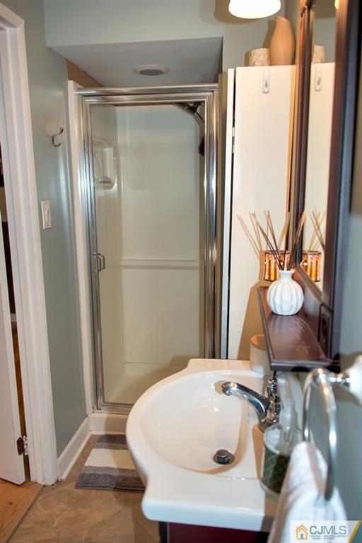 18 Chelsea Road Old Bridge, NJ 08857 - Photo 11 of 25 a bathroom with a sink and a mirror
