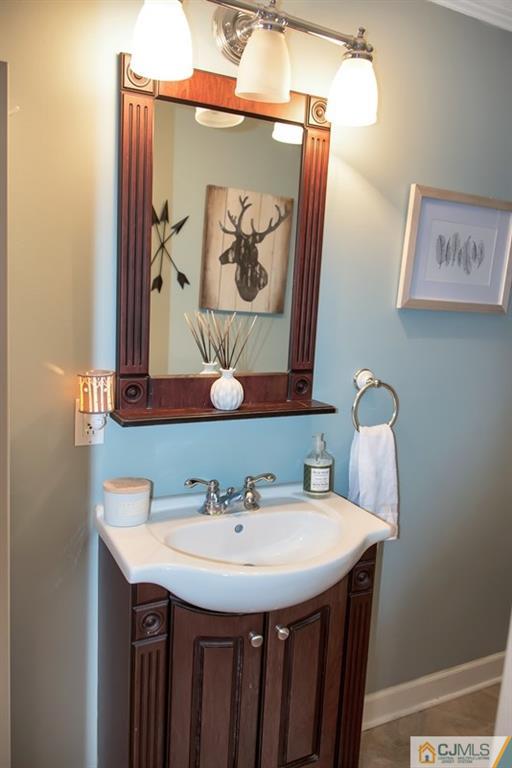 18 Chelsea Road Old Bridge, NJ 08857 - Photo 12 of 25 a bathroom with a sink and a mirror