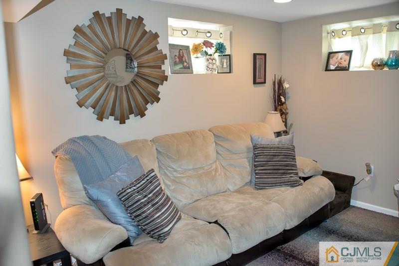 18 Chelsea Road Old Bridge, NJ 08857 - Photo 13 of 25 a living room with furniture and a painting
