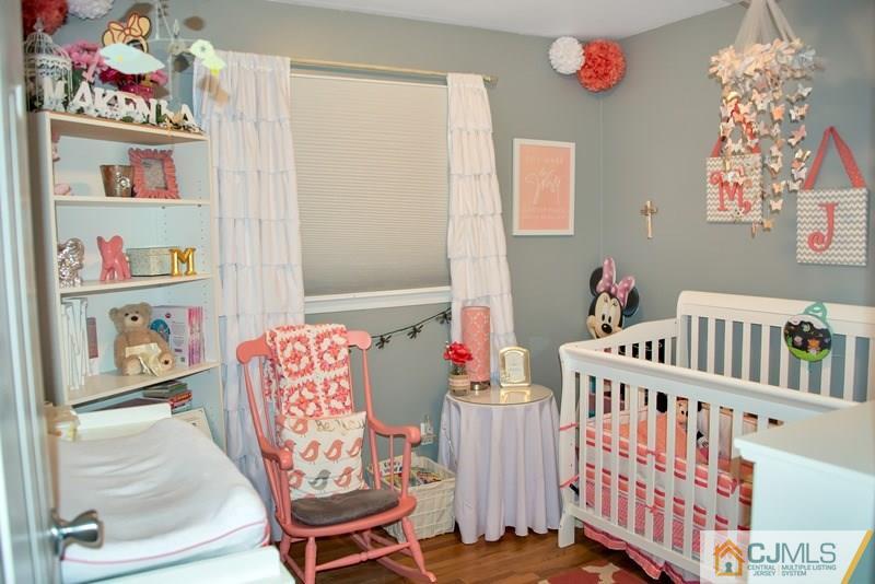 18 Chelsea Road Old Bridge, NJ 08857 - Photo 17 of 25 a bedroom with furniture and a book shelf