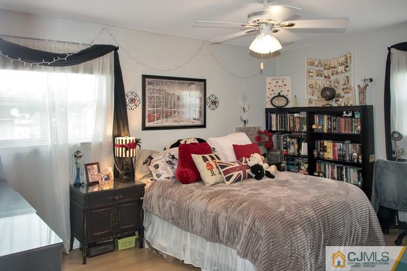 18 Chelsea Road Old Bridge, NJ 08857 - Photo 19 of 25 a bed room with a bed and a book shelf