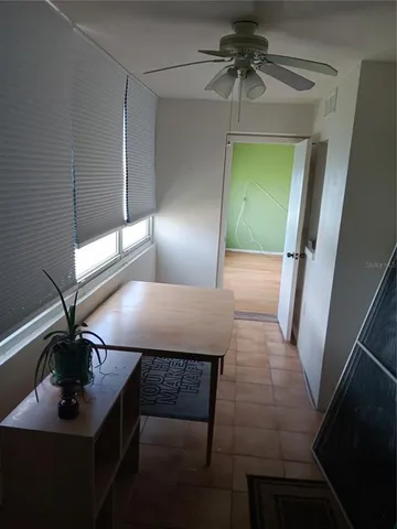 a view of a hallway with a chandelier
