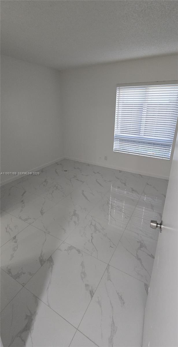 11150 Southwest 196th Street, Unit 105 Cutler Bay, FL 33157 - Photo 11 of 14 a view of a small space with window