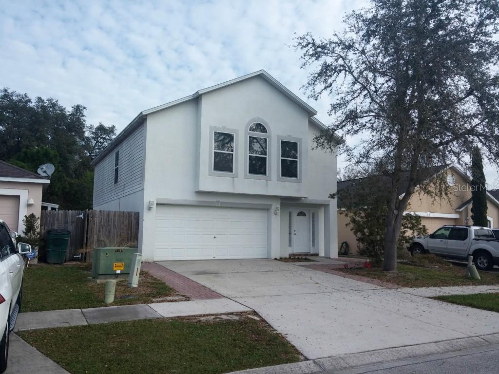 30538 Double Drive Wesley Chapel, FL 33545 - Photo 1 of 1 a front view of a house with a yard