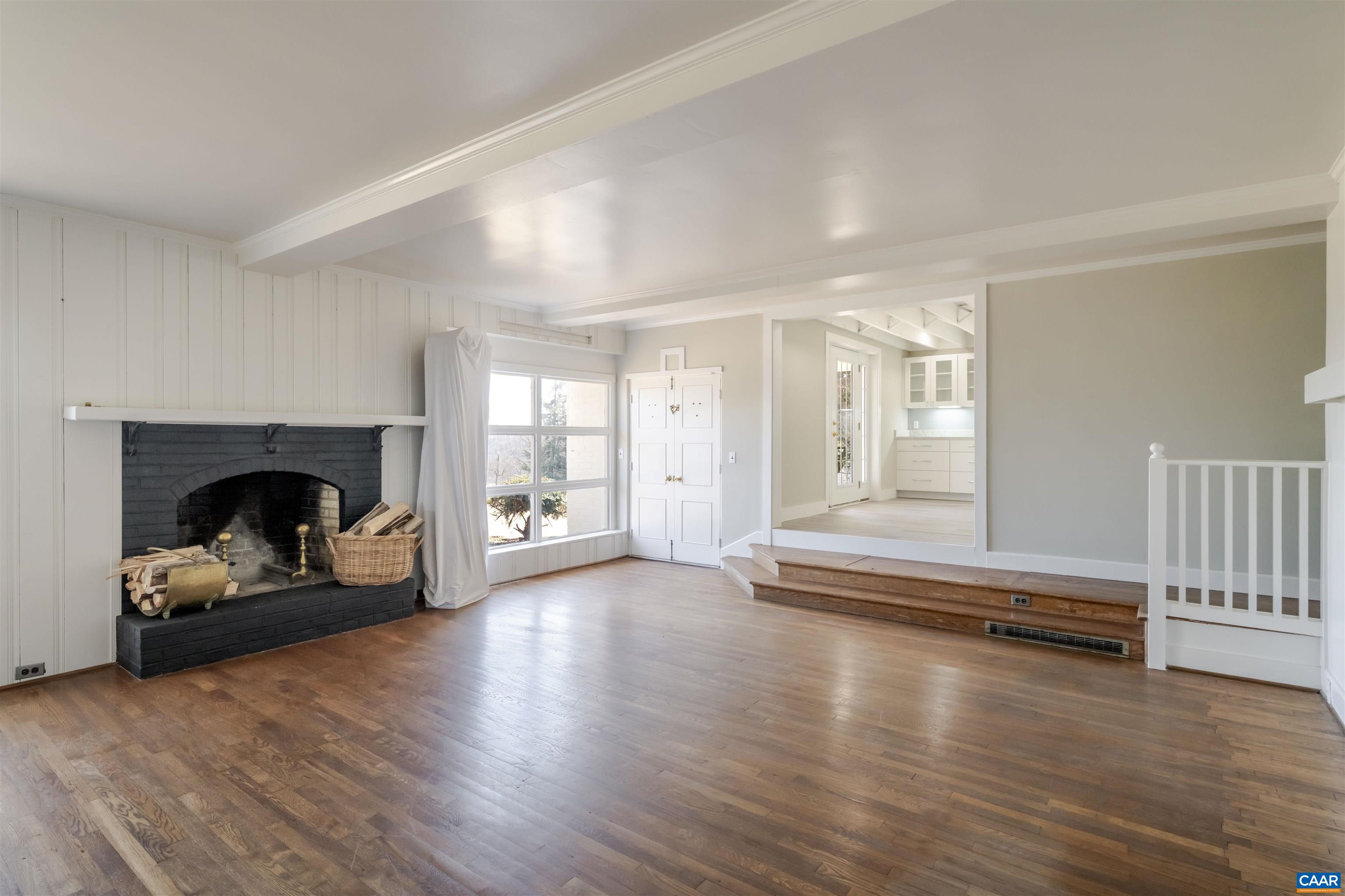 12413 Chicken Mountain Road Orange, VA 22960 - Photo 15 of 36 a view of a livingroom with wooden floor and a fireplace