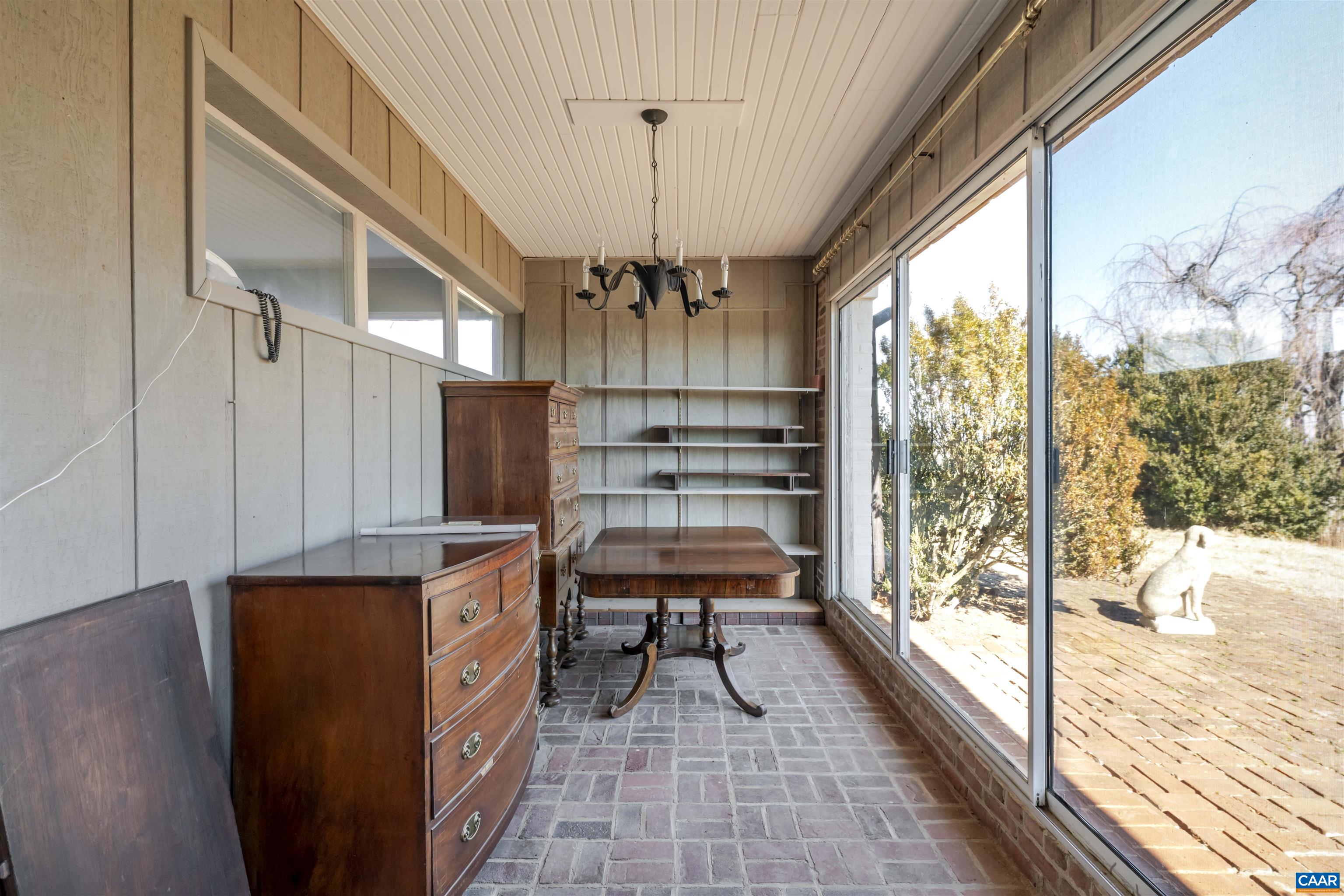 12413 Chicken Mountain Road Orange, VA 22960 - Photo 17 of 36 a view of a kitchen with a large window and wooden floor