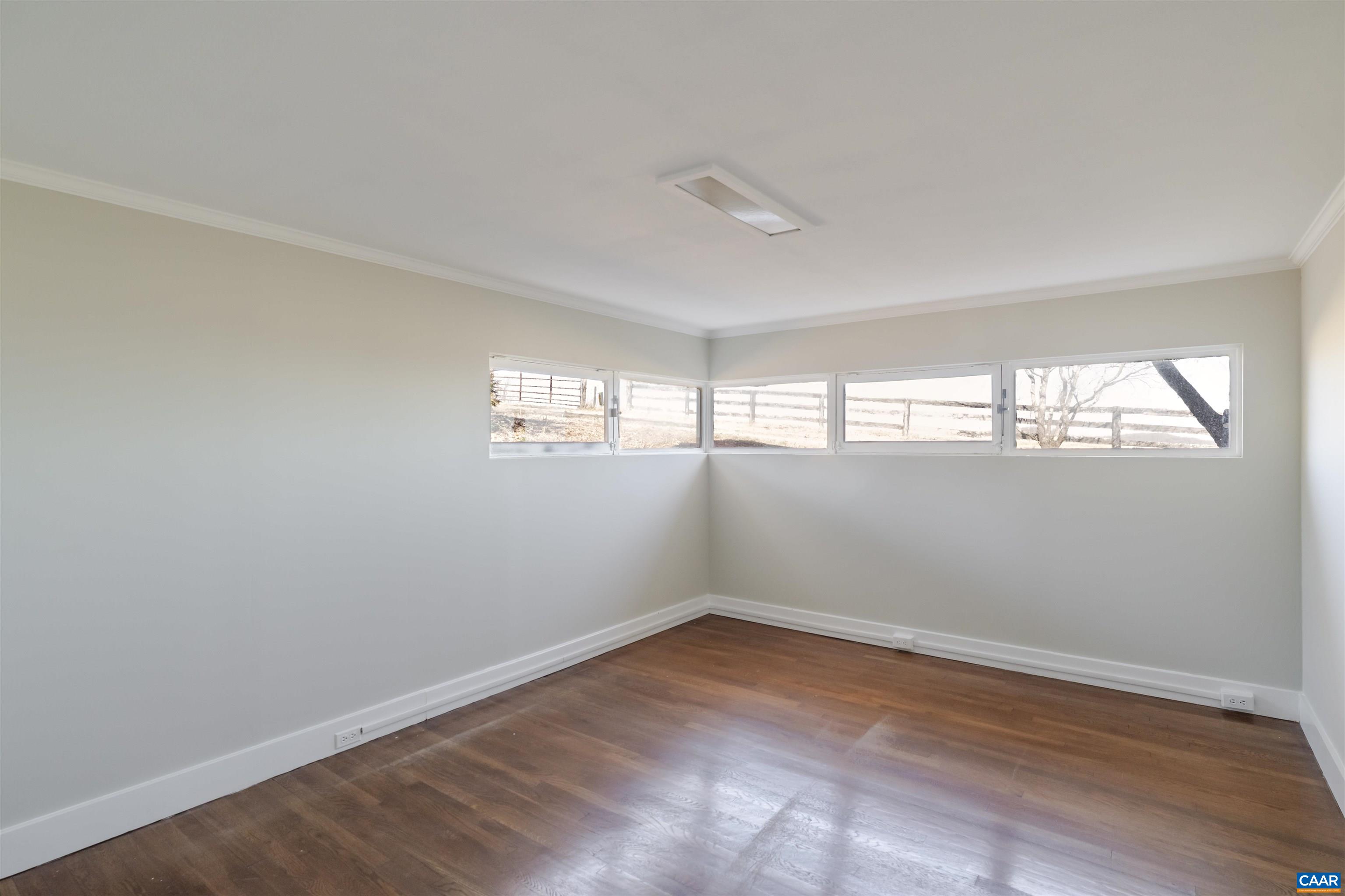 12413 Chicken Mountain Road Orange, VA 22960 - Photo 23 of 36 wooden floor in an empty room with a window