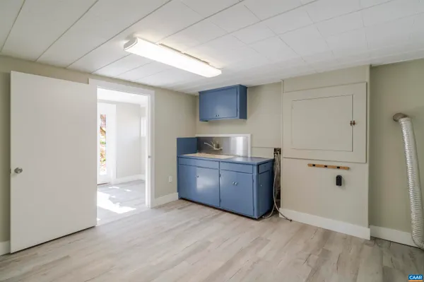 a kitchen with granite countertop a refrigerator and a sink
