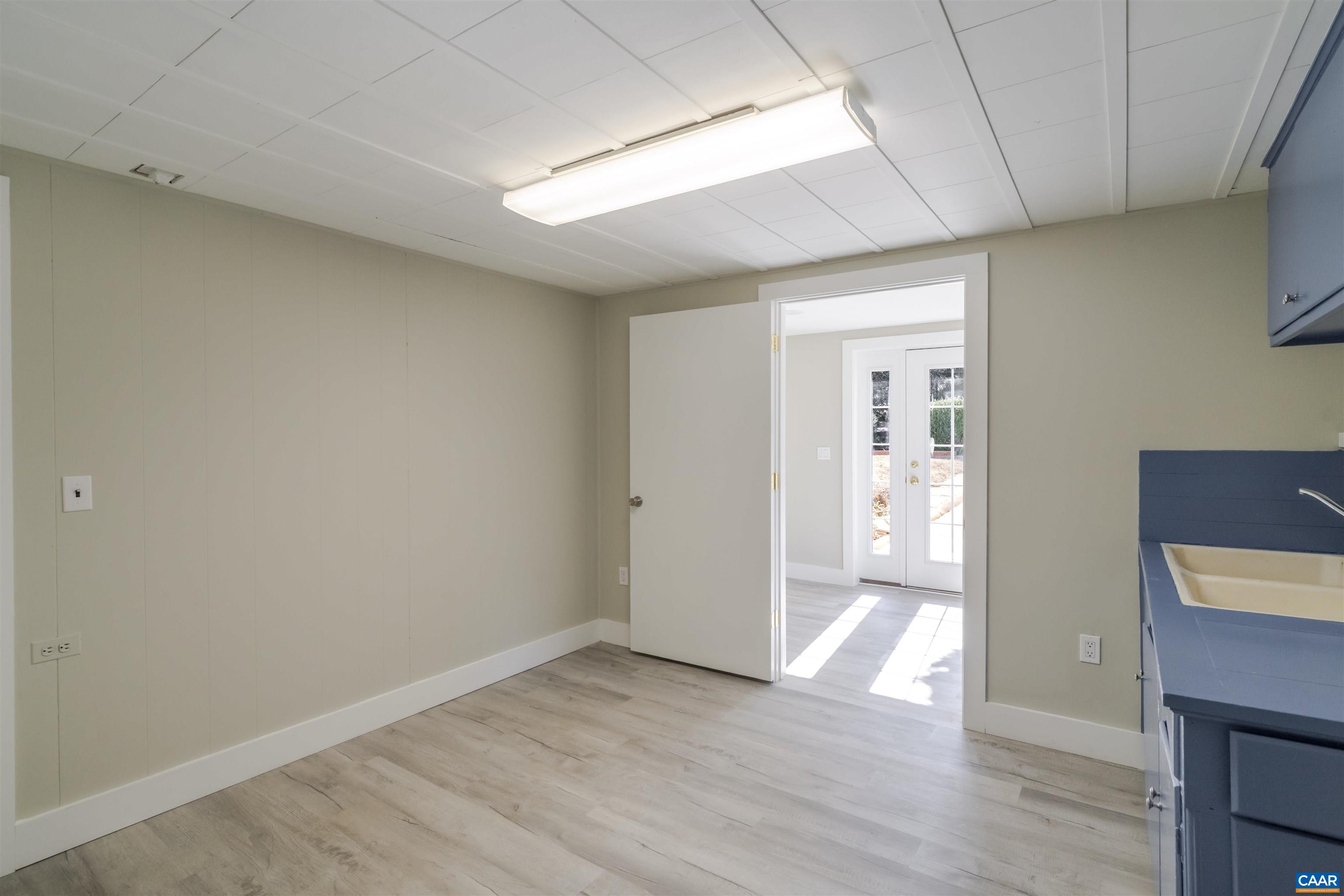 12413 Chicken Mountain Road Orange, VA 22960 - Photo 30 of 36 wooden floor in an empty room with a window