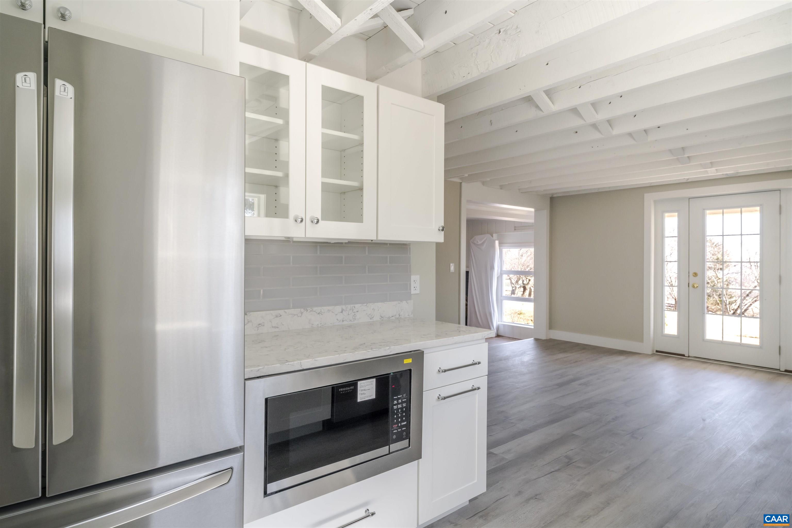 12413 Chicken Mountain Road Orange, VA 22960 - Photo 7 of 36 a view of an empty room with wooden floor and a window