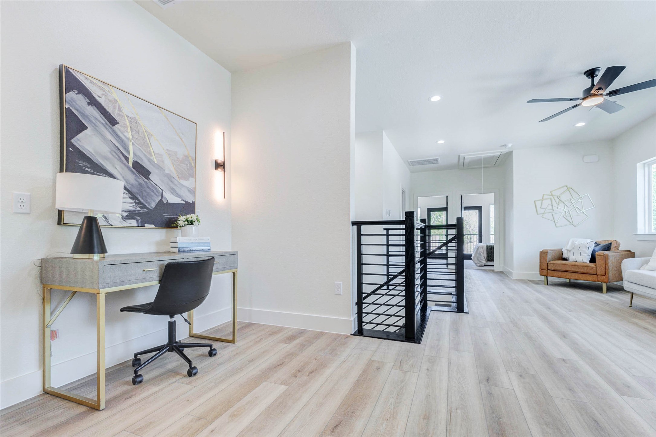 7115 England Street, Unit C Houston, TX 77021 - Photo 15 of 19 Versatile wide-plank flooring extends throughout the upstairs landing, which includes dedicated wall space for a workstation or console.