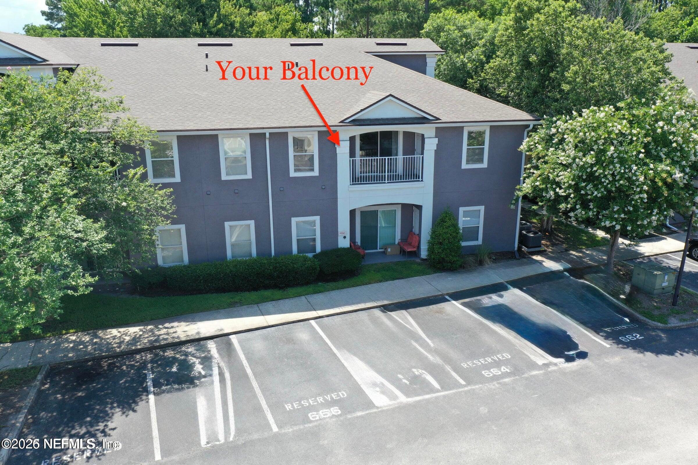 7920 Merrill Road, Unit 1509 Jacksonville, FL 32277 - Photo 1 of 11 a view of a white house with a yard
