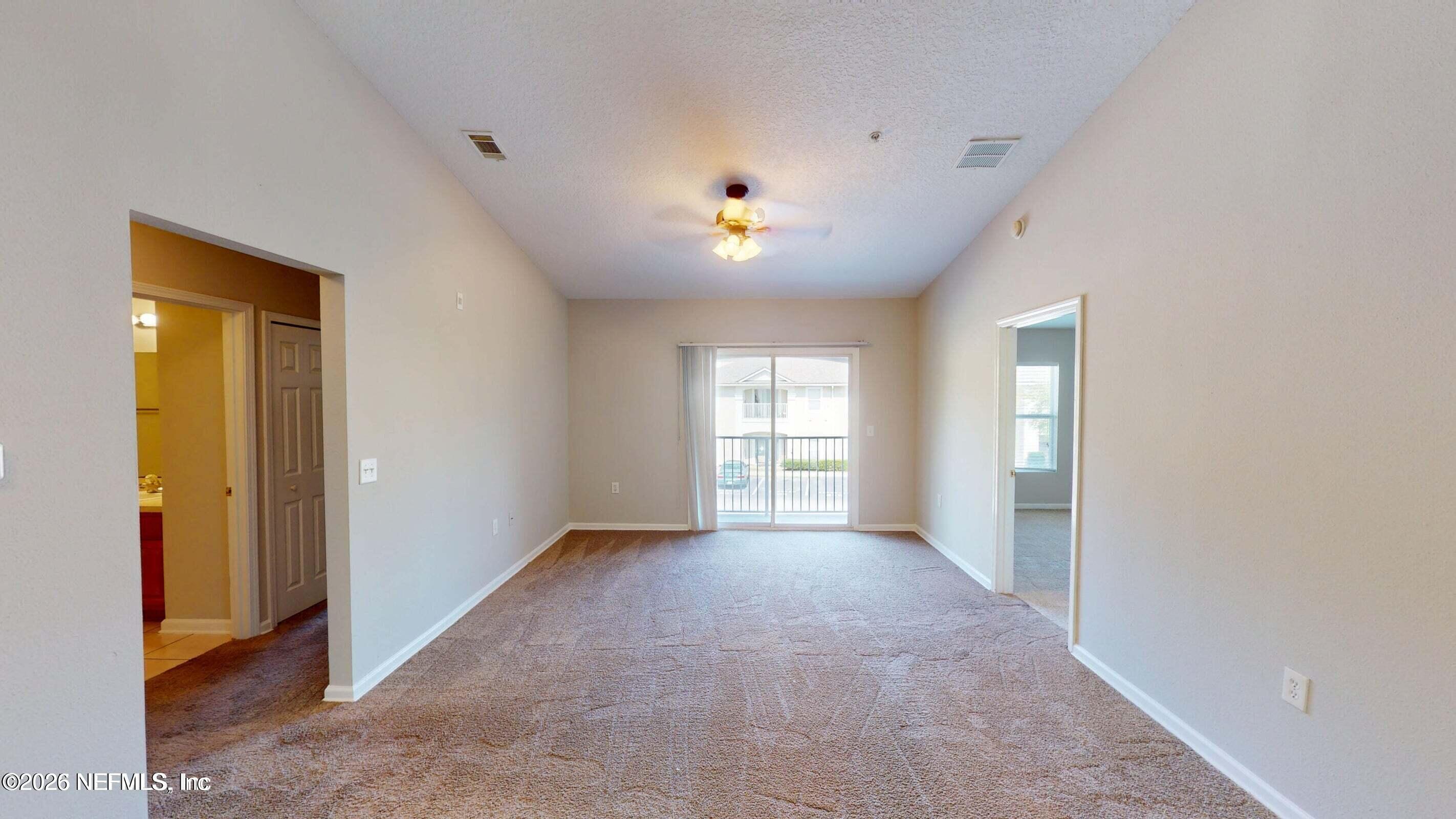 7920 Merrill Road, Unit 1509 Jacksonville, FL 32277 - Photo 2 of 11 a view of an empty room with a window