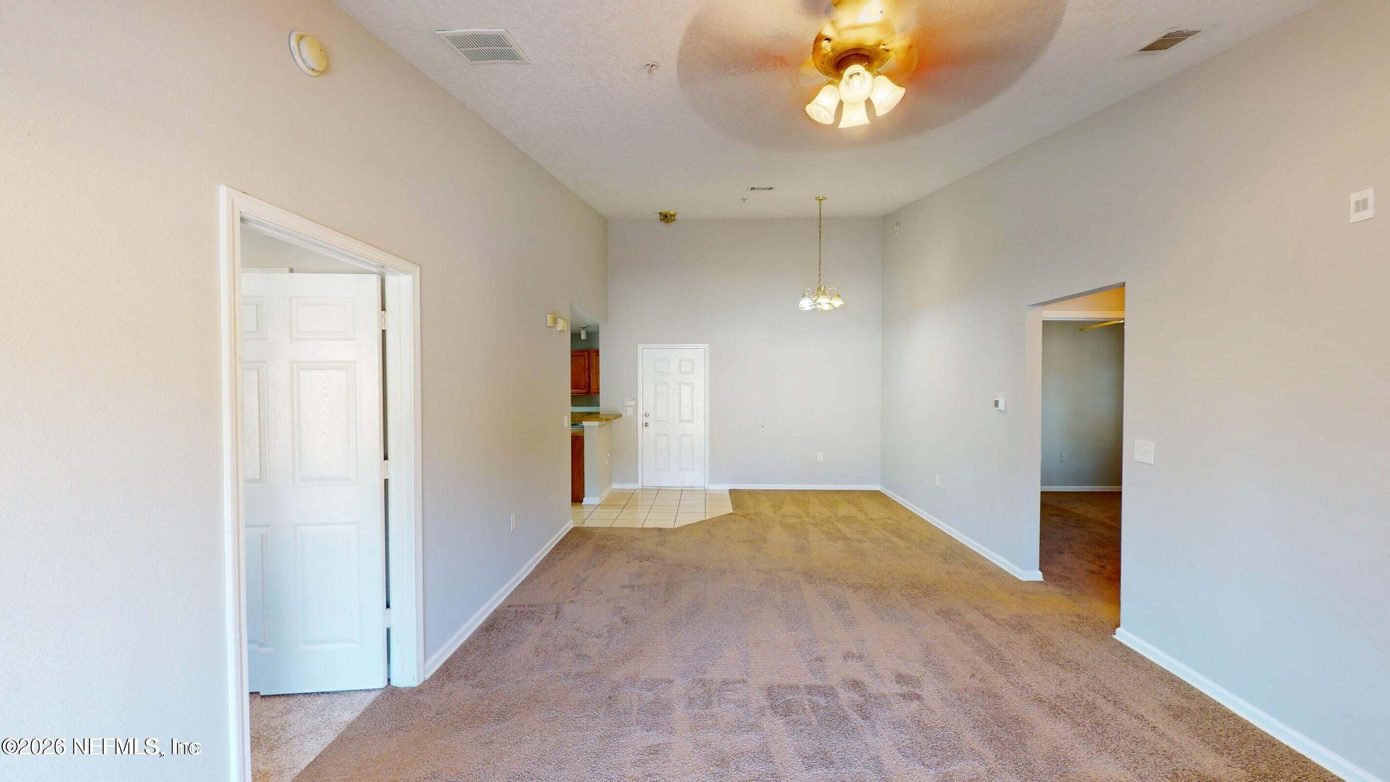 7920 Merrill Road, Unit 1509 Jacksonville, FL 32277 - Photo 3 of 11 a view of hallway with livingroom