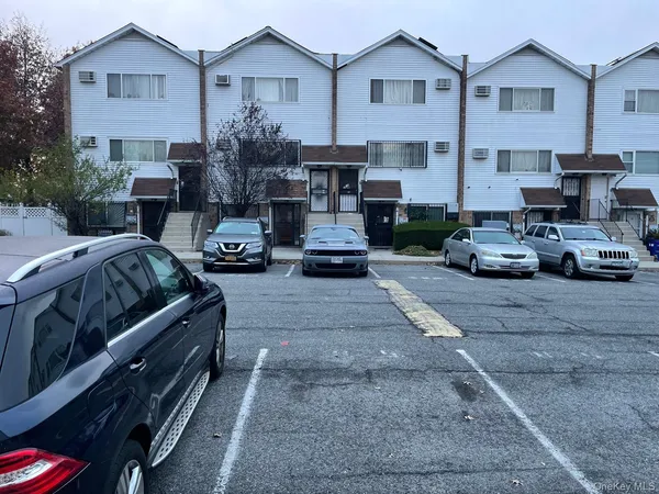 a view of a car parked in front of a house