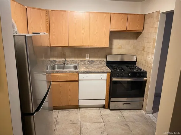 a kitchen with a stove microwave and refrigerator