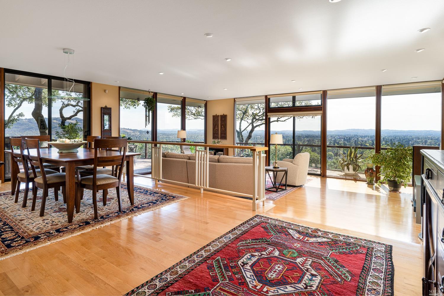 1828 Happy Valley Road Santa Rosa, CA 95404 - Photo 1 of 1 a living room with dining room and large windows