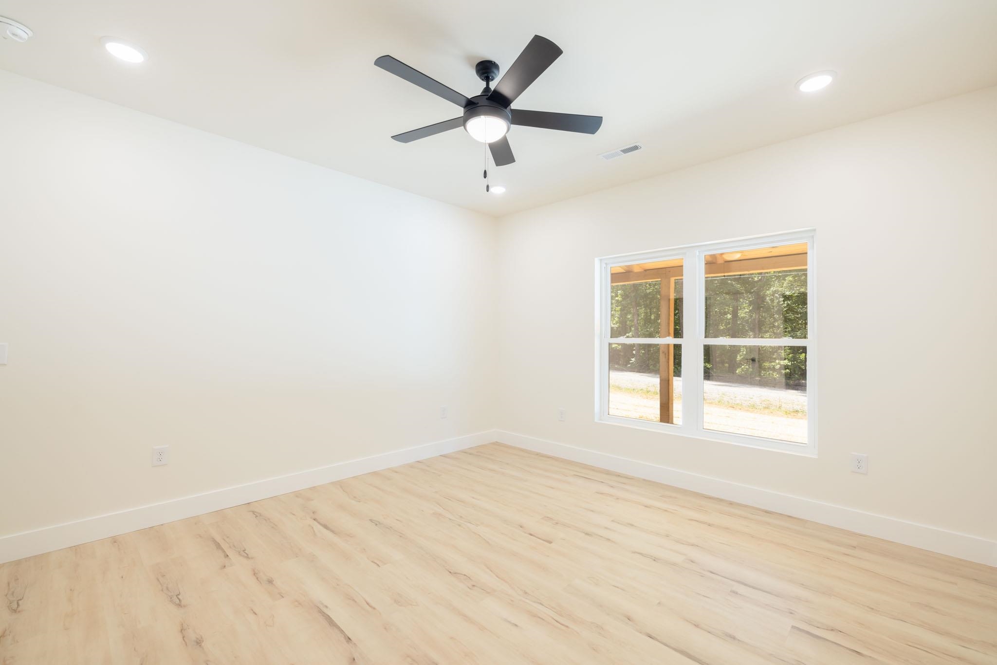 37 William Teague Lane Ramer, TN 38367 - Photo 32 of 39 Room featuring wood-finish flooring and neutral wall tones