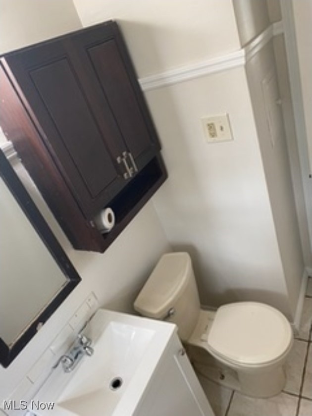 13206 Rockside Road Garfield Heights, OH 44125 - Photo 12 of 15 Bathroom with tile patterned floors and vanity