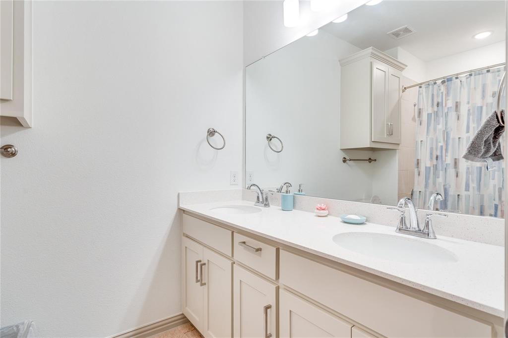7368 Panicum Drive Frisco, TX 75033 - Photo 16 of 25 Bathroom featuring curtained shower and vanity