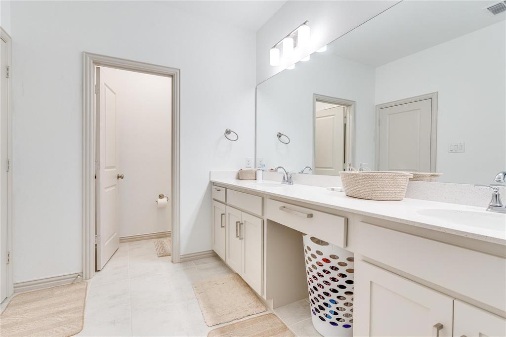 7368 Panicum Drive Frisco, TX 75033 - Photo 24 of 25 Bathroom with tile patterned flooring and vanity