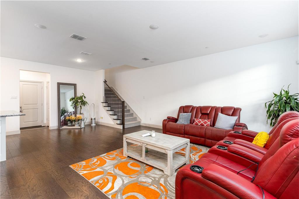 7368 Panicum Drive Frisco, TX 75033 - Photo 3 of 25 Living room with dark hardwood / wood-style floors
