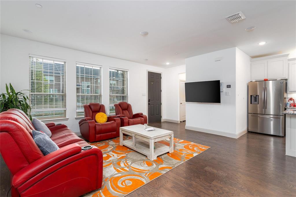 7368 Panicum Drive Frisco, TX 75033 - Photo 4 of 25 Living room featuring dark hardwood / wood-style flooring