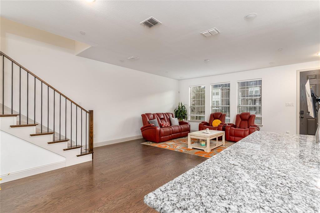 7368 Panicum Drive Frisco, TX 75033 - Photo 6 of 25 Living room with dark wood-type flooring