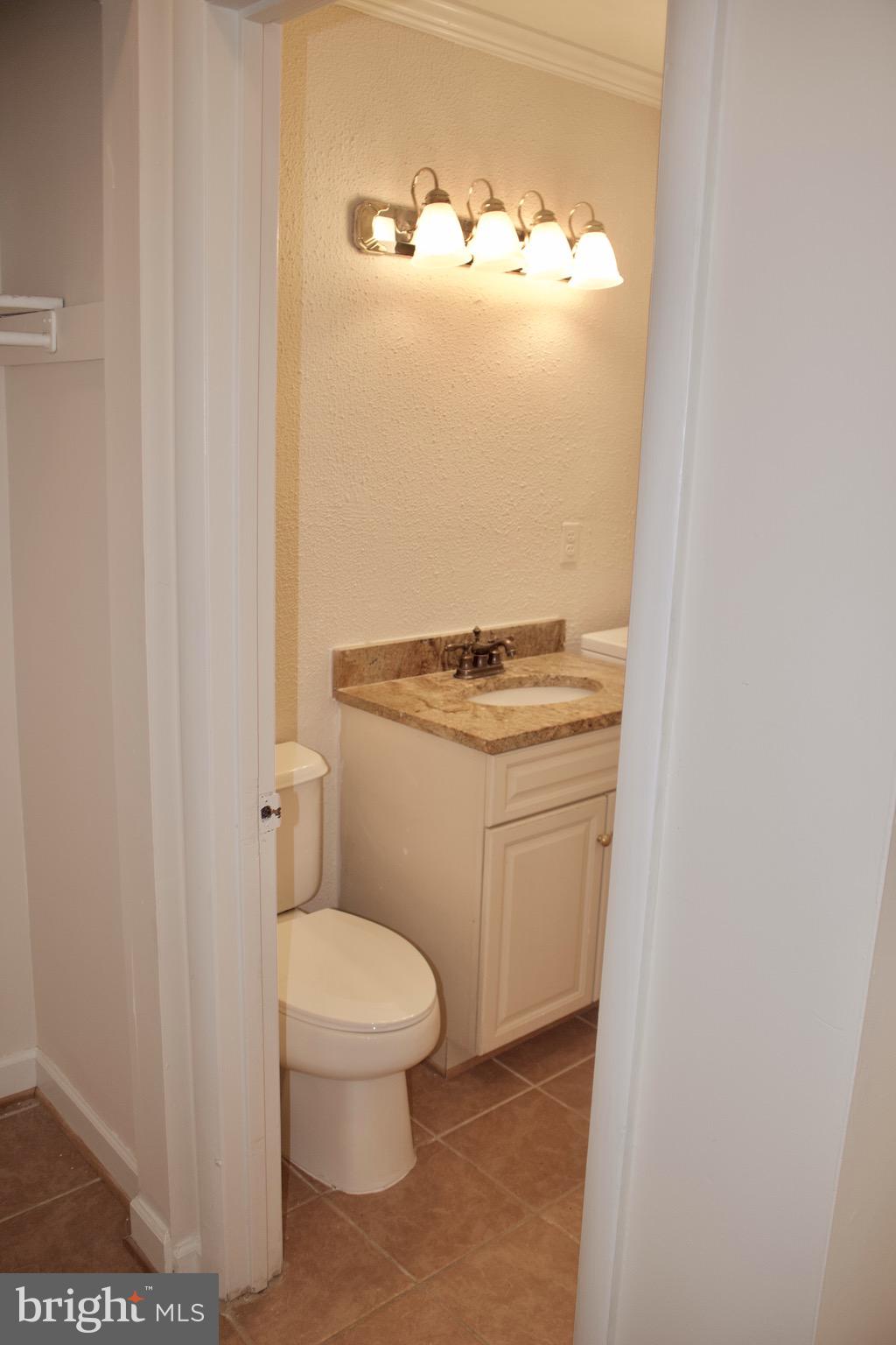 9731 Ashbourn Drive Burke, VA 22015 - Photo 7 of 26 Main Level Powder Room with laundry