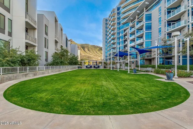 a view of a building with a yard