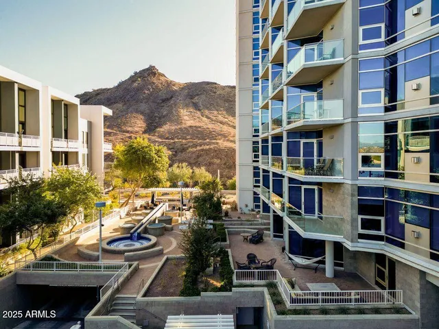 a view of multiple houses with a swimming pool
