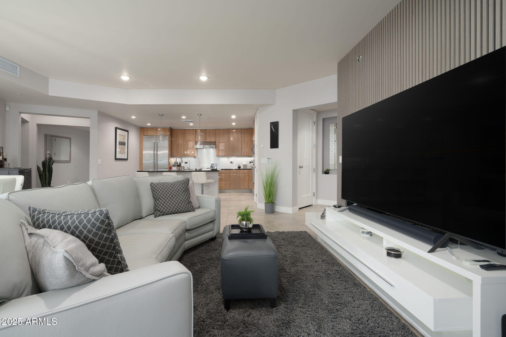 140 East Rio Salado Parkway, Unit 504 Tempe, AZ 85281 - Photo 9 of 51 a living room with furniture and a flat screen tv