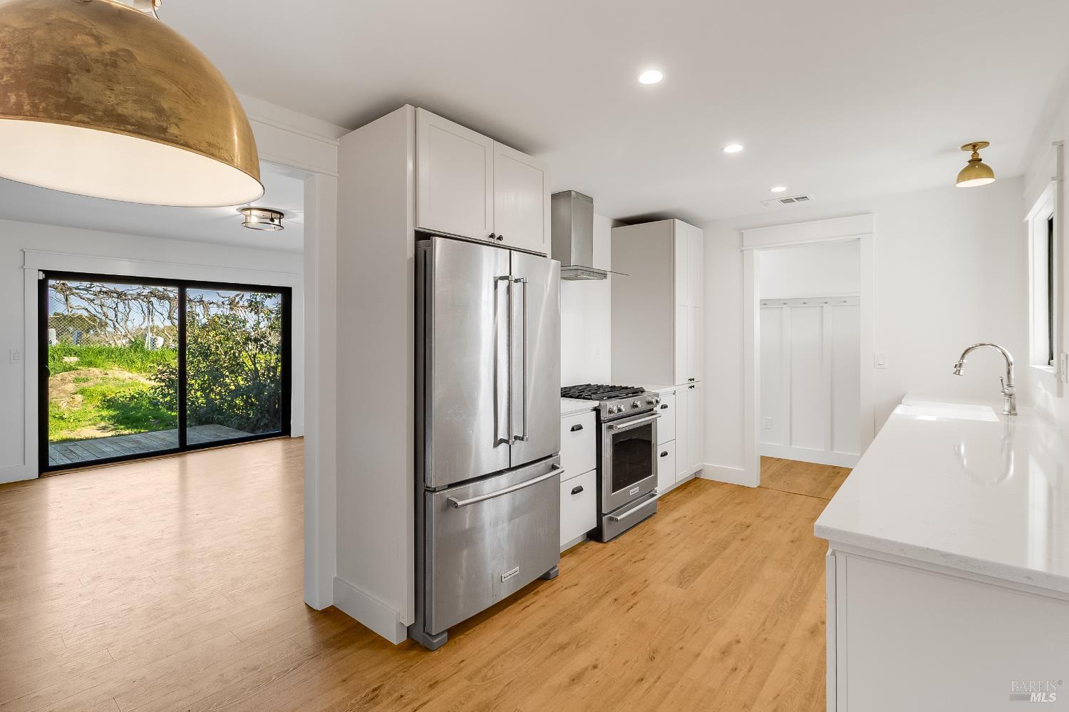 180 Sierra Avenue Rio Vista, CA 94571 - Photo 12 of 49 Kitchen flows into the dining area. There is a built-in seat by the dining area window with storage underneath.