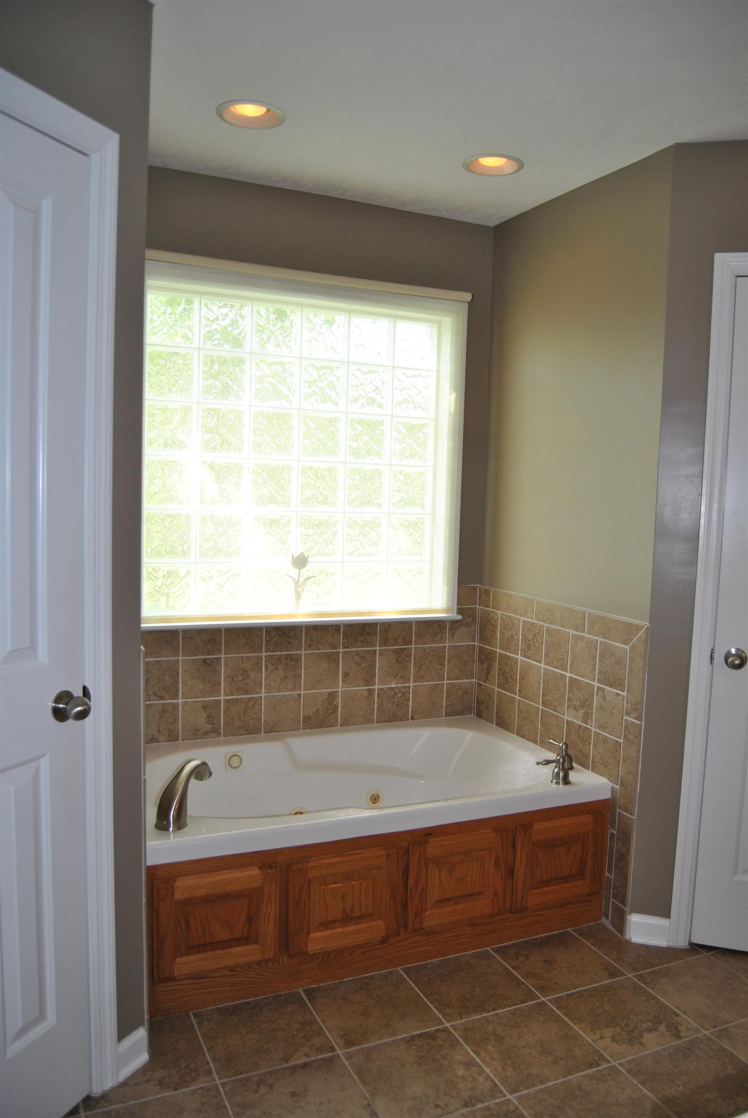 2397 Paul Harrell Road Beechgrove, TN 37018 - Photo 24 of 29 Jacuzzi tub, and porcelain tile floors.