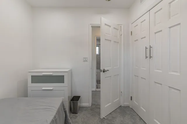 a room with a closet and a mirror