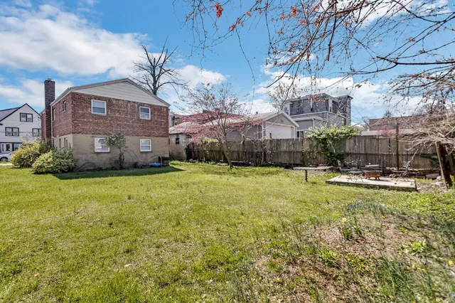 a front view of a house with a yard table and chairs