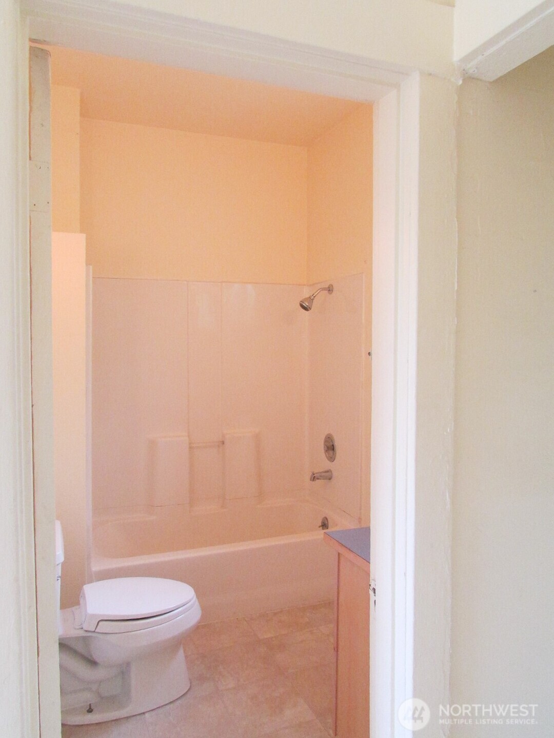 3823 Delridge Way Southwest Seattle, WA 98106 - Photo 16 of 18 a white toilet sitting next to a shower curtain