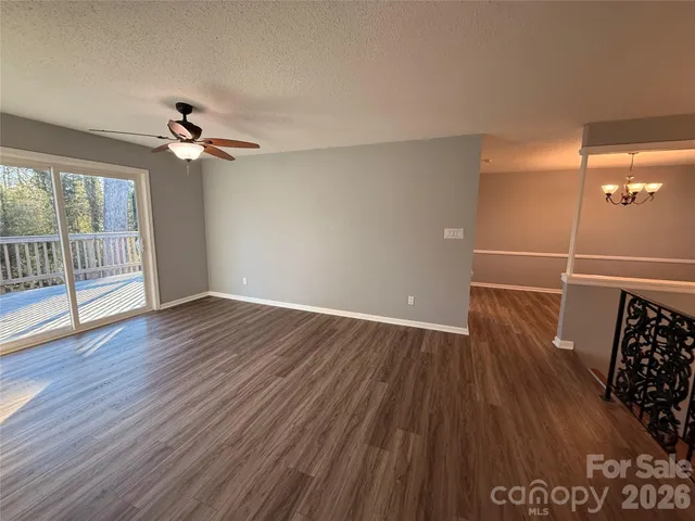 a view of balcony with wooden floor and fence