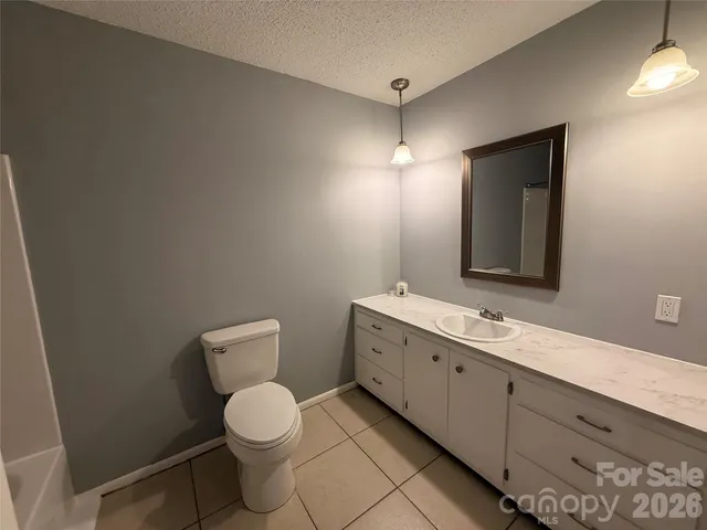 a view of road with large trees