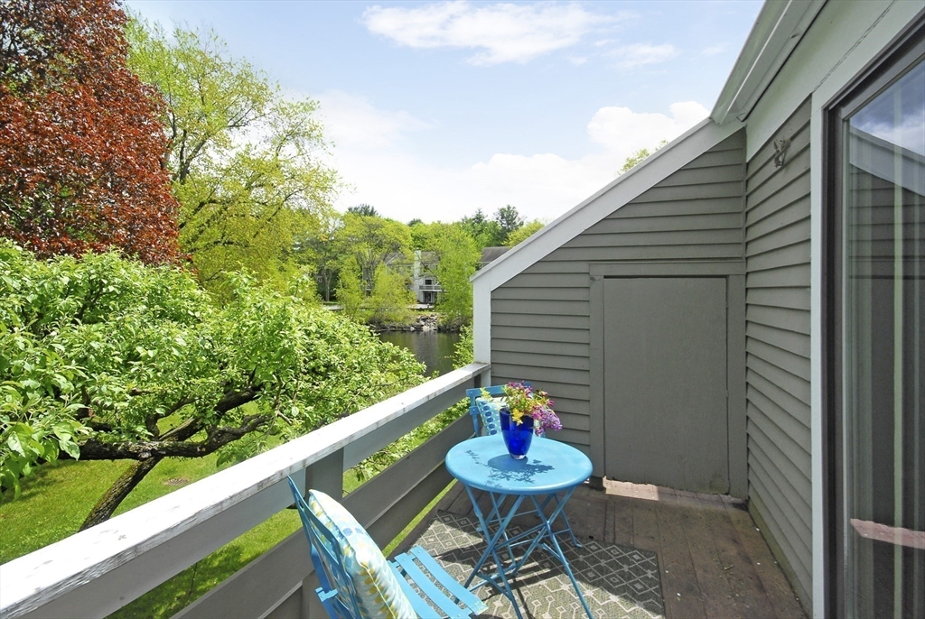 18 Concord Greene, Unit 6 Concord, MA 01742 - Photo 17 of 24 a view of a chairs and table in the balcony