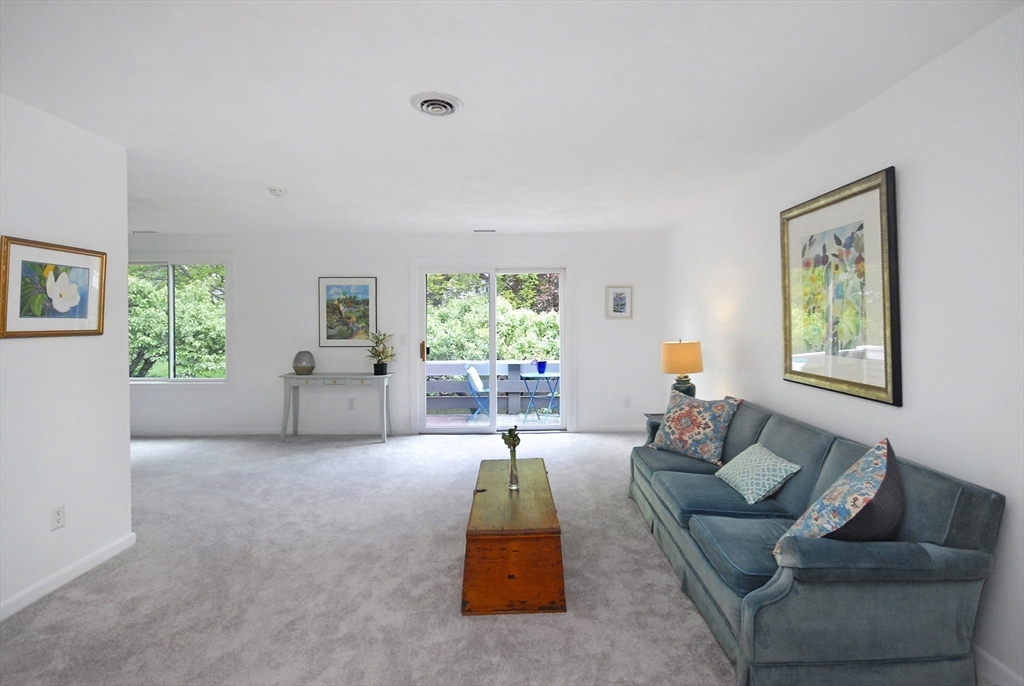 18 Concord Greene, Unit 6 Concord, MA 01742 - Photo 2 of 24 a living room with furniture and a window