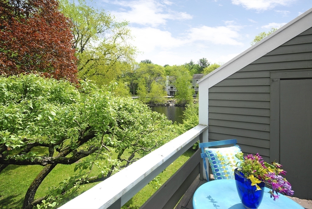 18 Concord Greene, Unit 6 Concord, MA 01742 - Photo 22 of 24 a view of a house with a flower garden