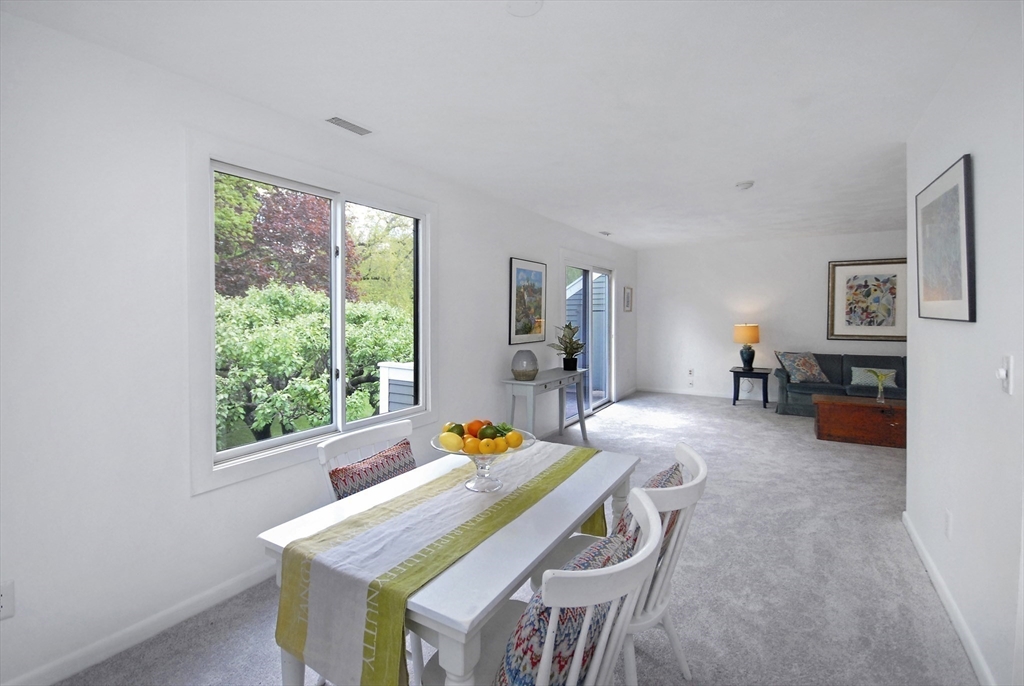 18 Concord Greene, Unit 6 Concord, MA 01742 - Photo 3 of 24 a living room with furniture and a window