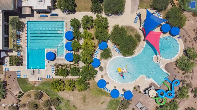 an aerial view of a house a yard and outdoor seating