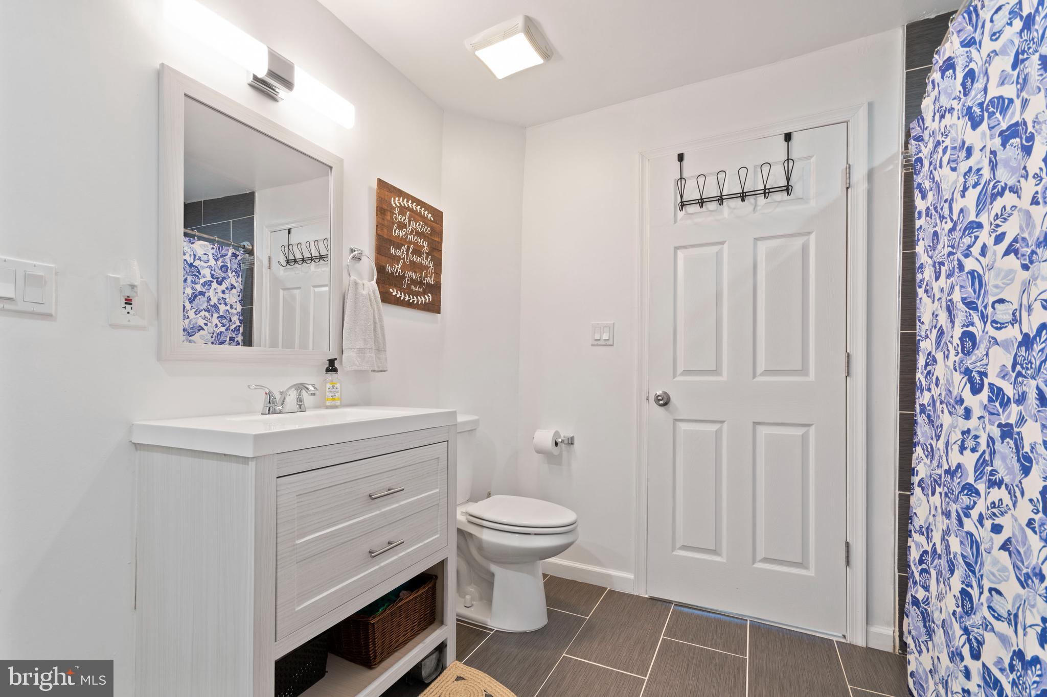 1 West Post Road Morrisville, PA 19067 - Photo 13 of 16 a bathroom with a sink a toilet and a mirror