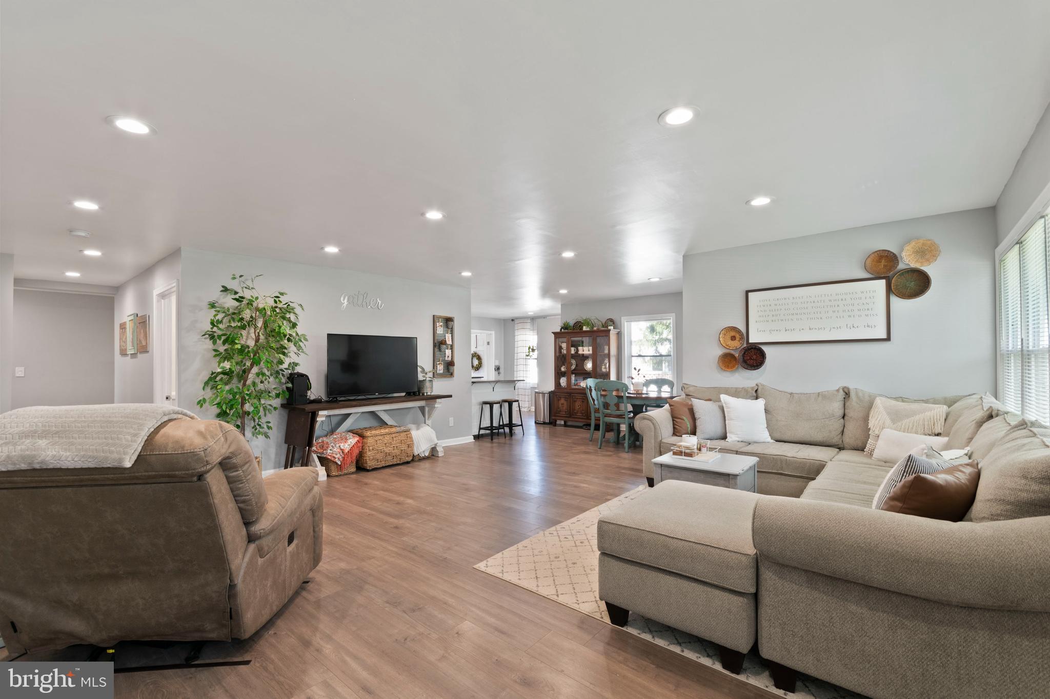 1 West Post Road Morrisville, PA 19067 - Photo 2 of 16 a living room with furniture and a flat screen tv