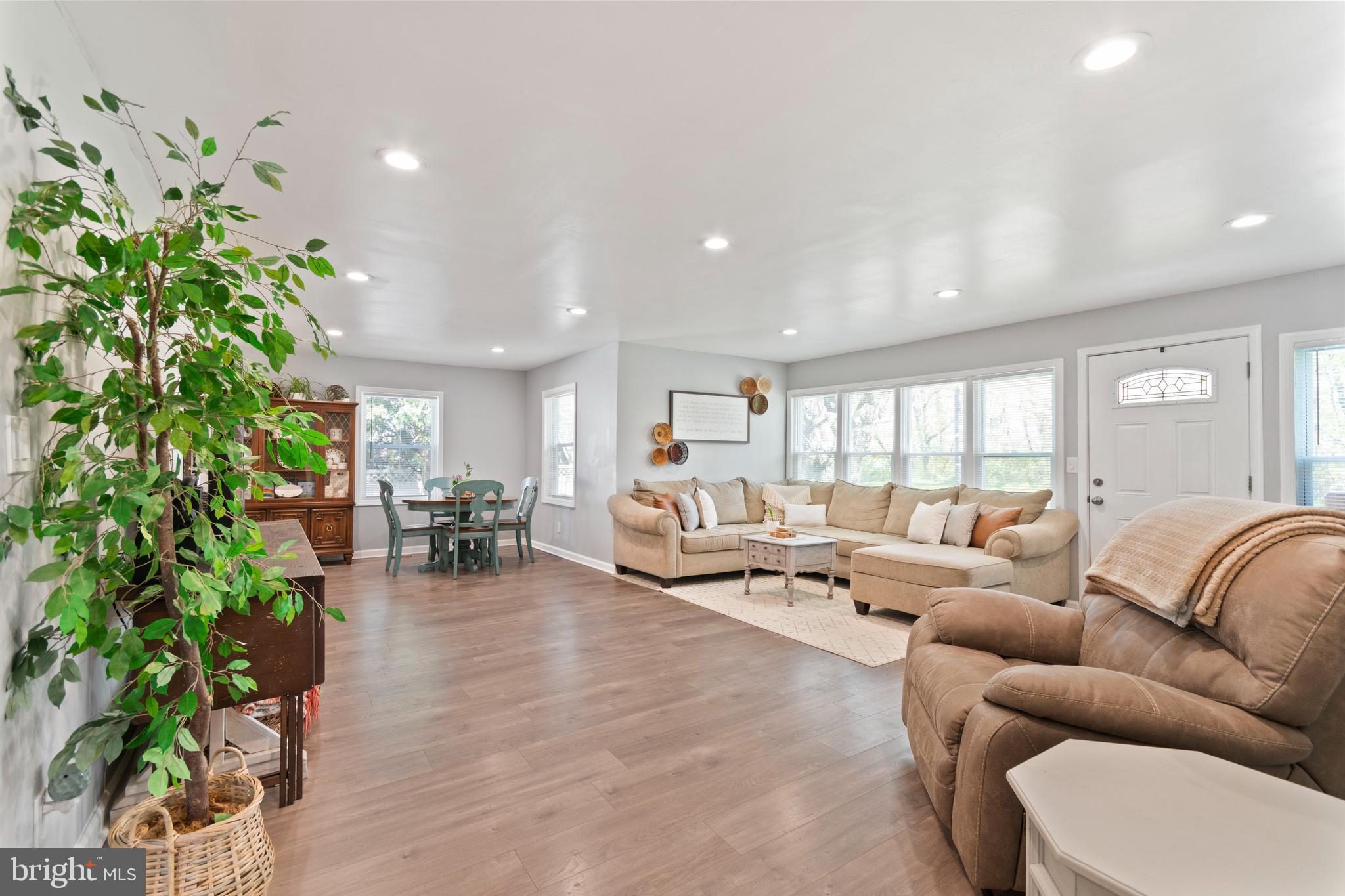 1 West Post Road Morrisville, PA 19067 - Photo 3 of 16 a living room with furniture potted plant and a large window