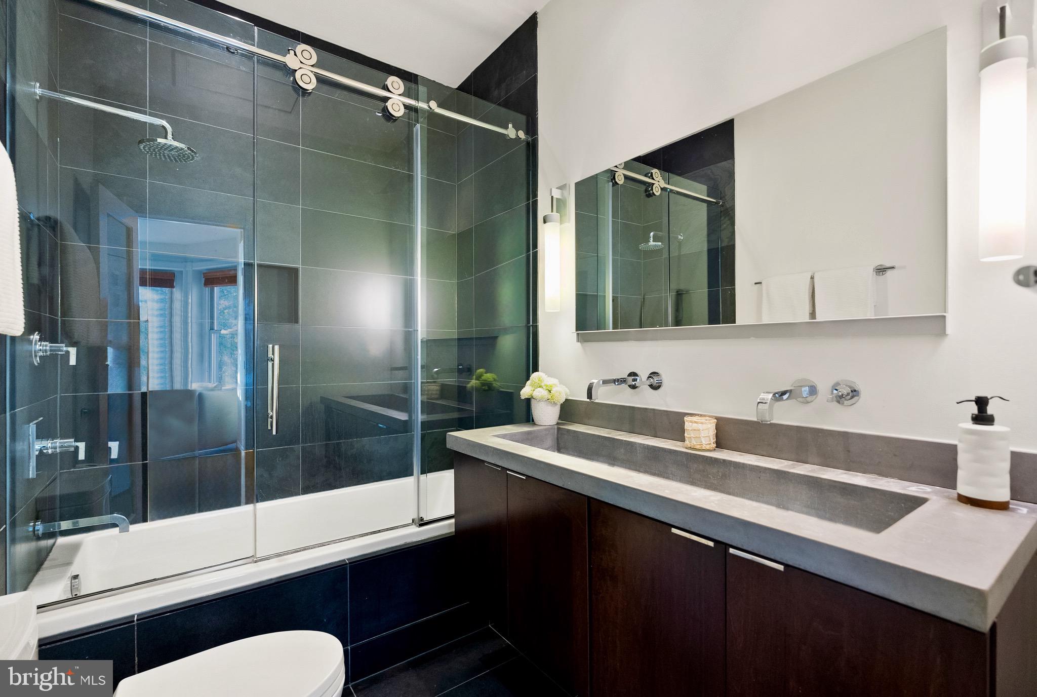 925 R Street Northwest Washington, DC 20001 - Photo 17 of 23 a bathroom with a sink and a mirror