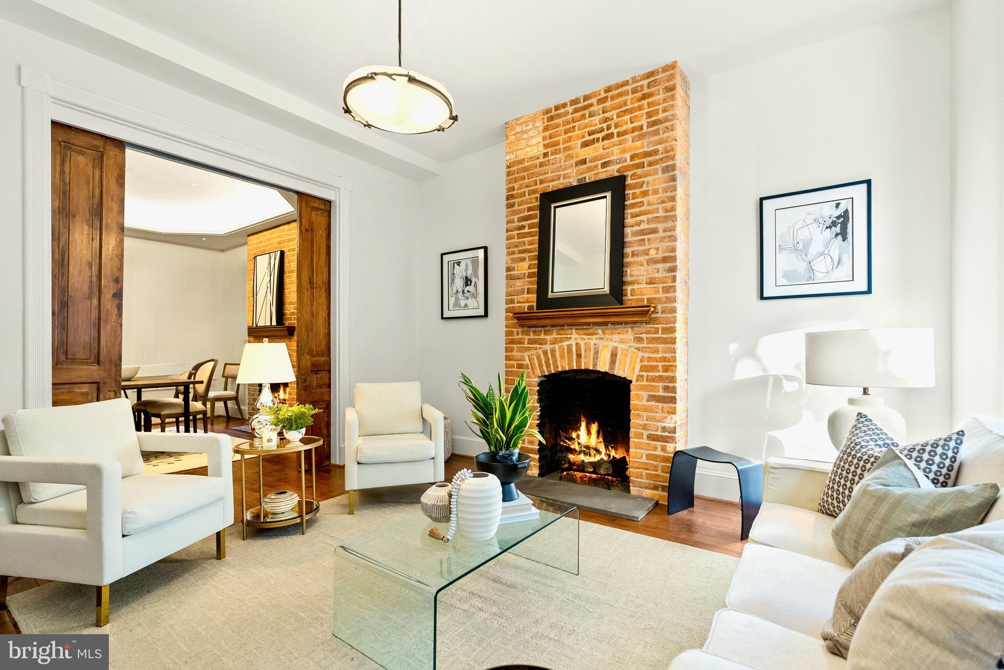 925 R Street Northwest Washington, DC 20001 - Photo 7 of 23 a living room with furniture large window and fireplace
